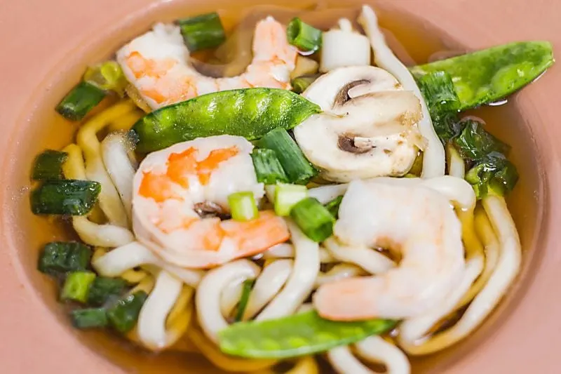 Looking for a slurpy noodle soup? Hawaiian Saimin Soup is an easy broth to make that uses Udon noodles. Saimin Soup close up in bowl