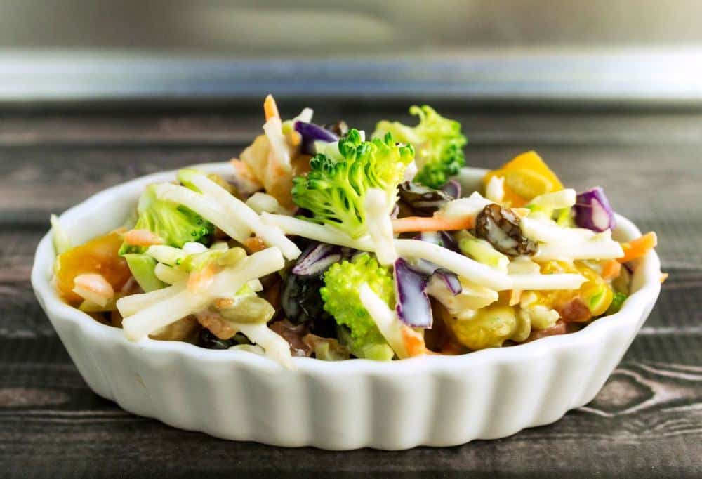Broccoli Sunshine Salad adds dried apricots to a traditional broccoli salad for a great taste that you will love. 