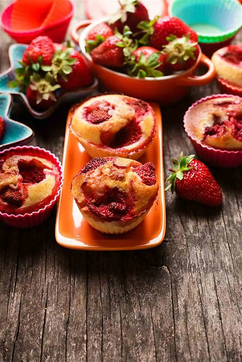 Mango Strawberry Muffins On a wooden table