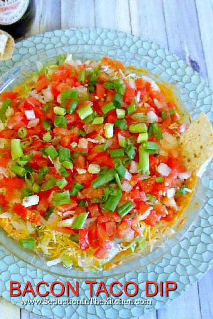 Bacon Taco Dip is a twist on taco dip that is very tasty and it also has bacon in it! Great for a party, Cinco de Mayo, or anytime you like! 