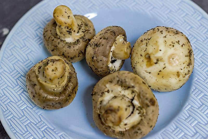 Marinated Garlic Mushrooms overhead view on blue plate