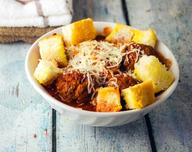 Ravioli and Meatball Soup With Garlic Bread Croutons is a hearty soup that is garnished with garlic bread croutons that will fill you up.