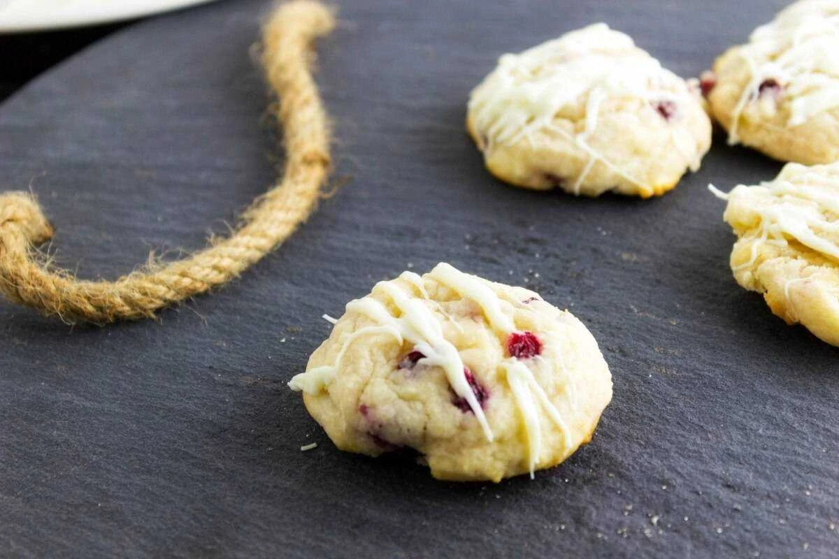Lemon Pomegranate Cookies are a delightful cookie that is sinful with the white chocolate drizzle on it. One bite and you will be in love
