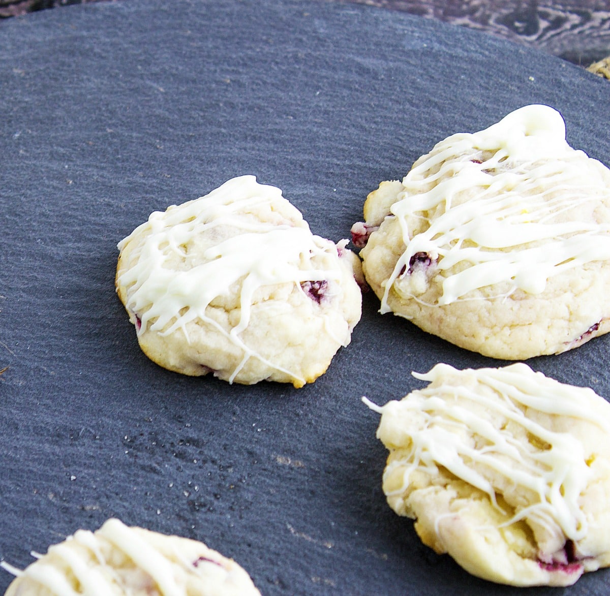 Lemon Pomegranate Cookies are a delightful cookie that is sinful with the white chocolate drizzle on it. One bite and you will be in love.