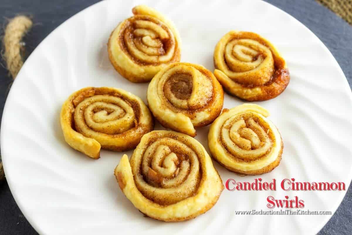 Candied Cinnamon Swirls is so easy to make with only 4 ingredients! They can easily become addictive so you want to make sure you make plenty of these treats. A recipe from Seduction in the Kitchen.