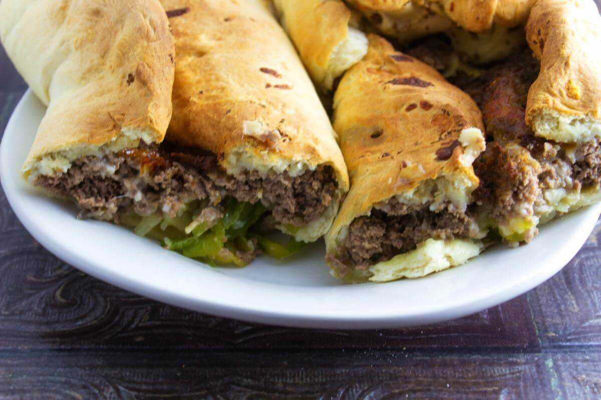 Philly Cheesesteak stromboli cut open on plate