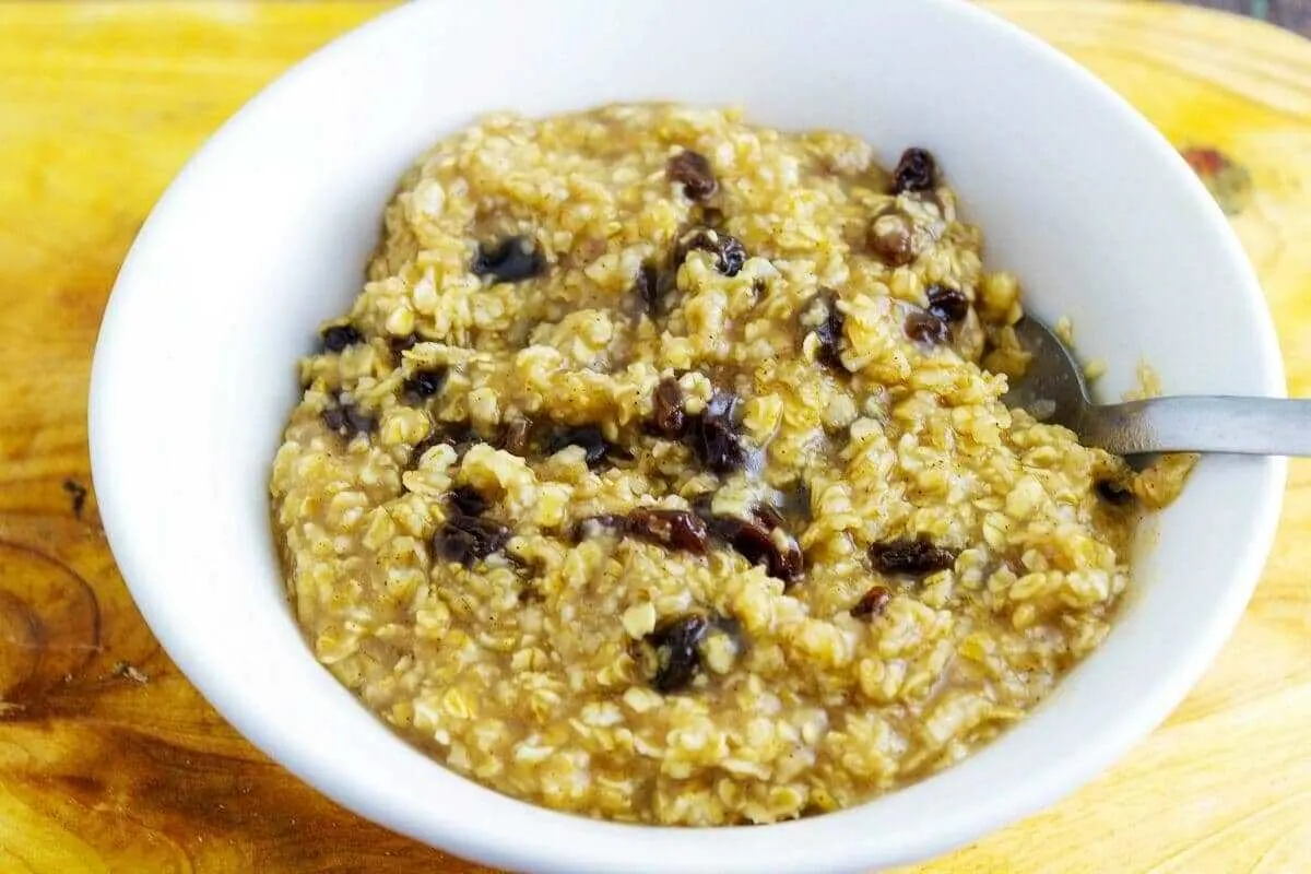 Brown Sugar Cinnamon Oatmeal in bowl on table and with spoon