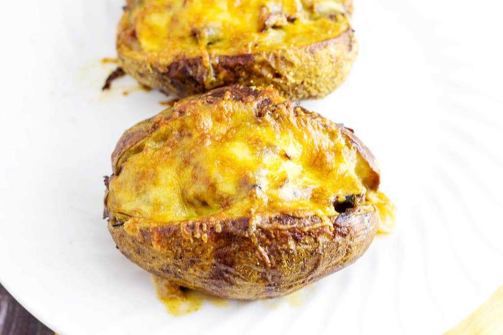 Roast Beef Stuffed Baked Potatoes is a meal in itself. Tender roast beef with caramelized onions and au jus gravy stuffed into a potato with melted cheese.