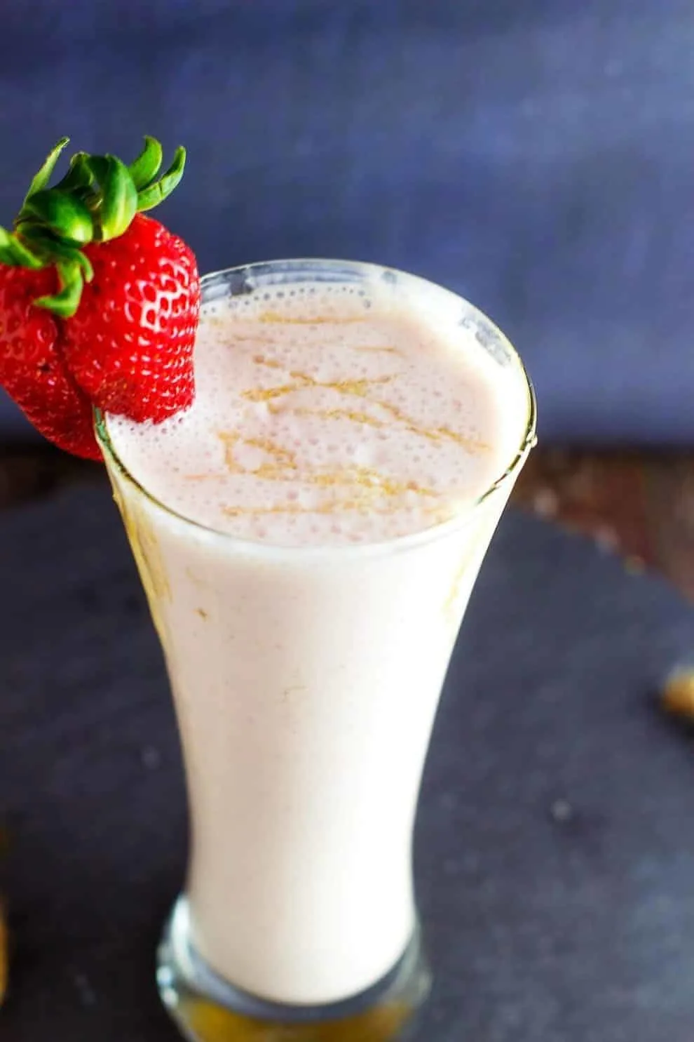 Honey Roasted Strawberry Cheesecake Smoothie is a healthy and delicious smoothie that you will love after a great workout! The honey roasted strawberries just make this smoothie pop with flavor. Best of all, it has no added sugar in it!