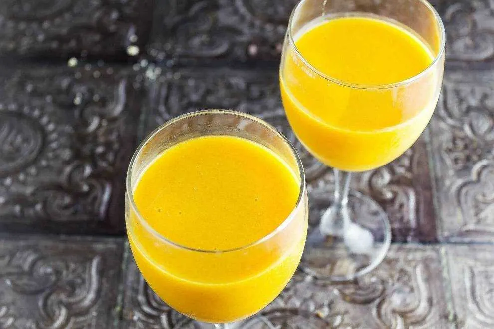 Mango Plum Wine Smoothie is a refreshing adult smoothie that is perfect for relaxing in the summer sun. Best of all this smoothie is only 2 ingredients! 