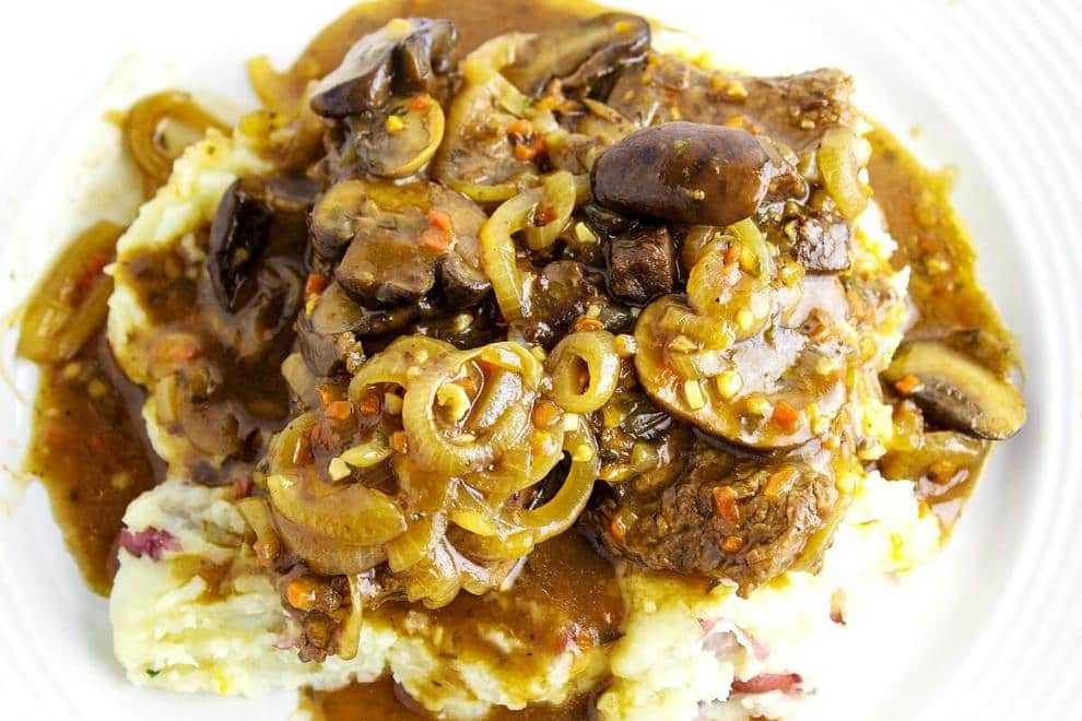 Mushroom and Onion Smothered Cube Steak is easy to make and is perfect for a weekend dinner. Tender cube steak smothered with a gravy, mushrooms, and onions on top of mashed potatoes.