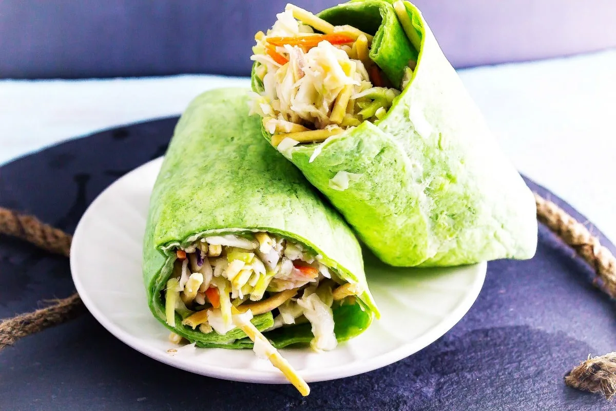 Asian Chicken Slaw Wraps is a healthy chicken salad with an Asian flavoring! Then it is all rolled up to make a delicious wrap.