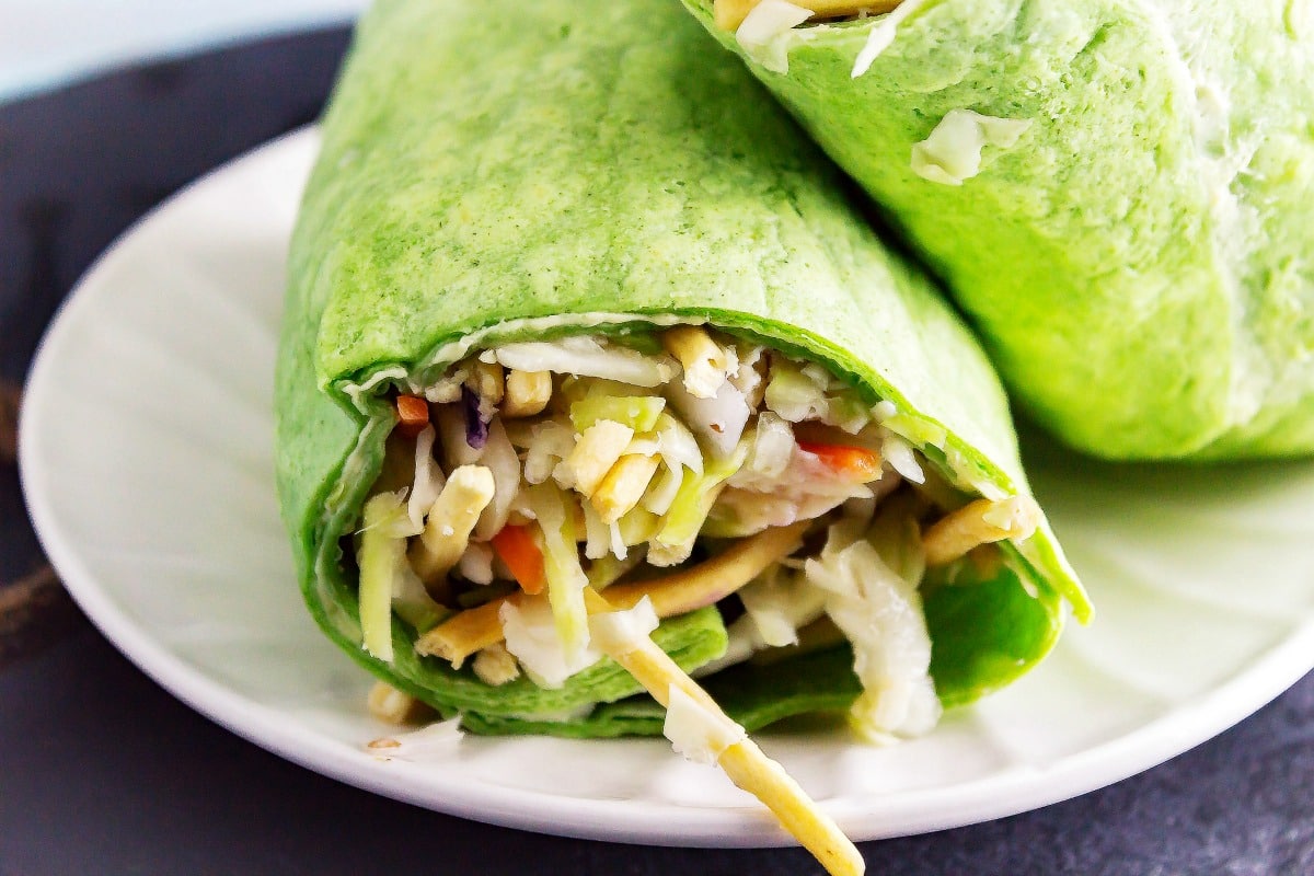 Asian Chicken Slaw Wraps is a healthy chicken salad with an Asian flavoring! Then it is all rolled up to make a delicious wrap.