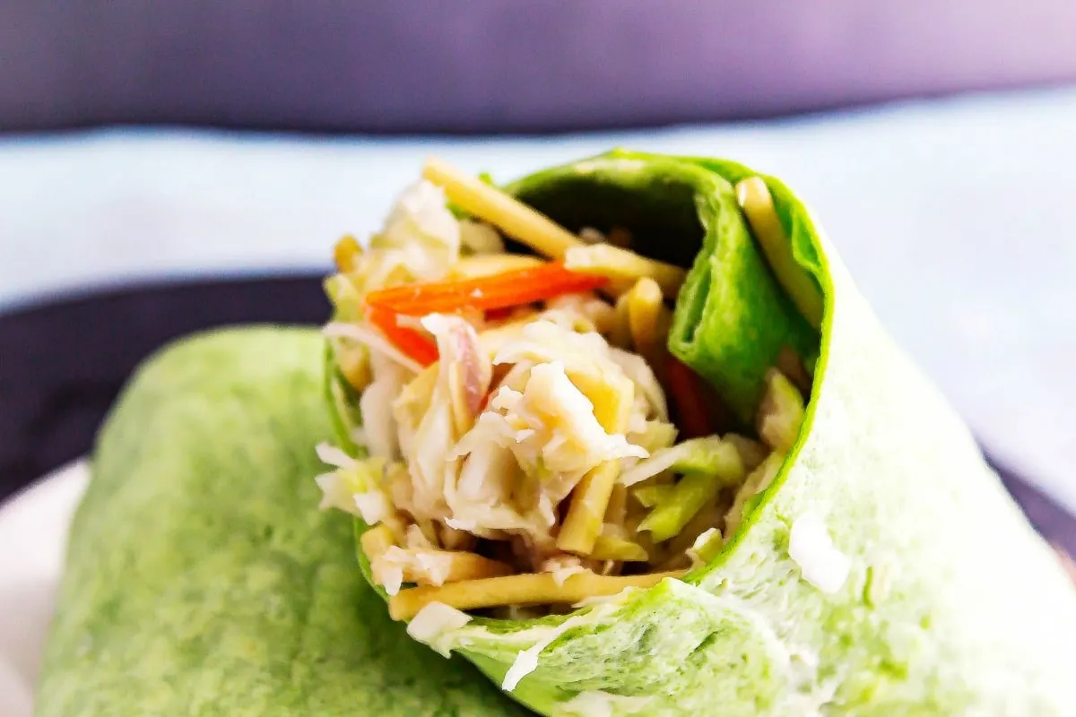 Asian Chicken Slaw Wraps is a healthy chicken salad with an Asian flavoring! Then it is all rolled up to make a delicious wrap.