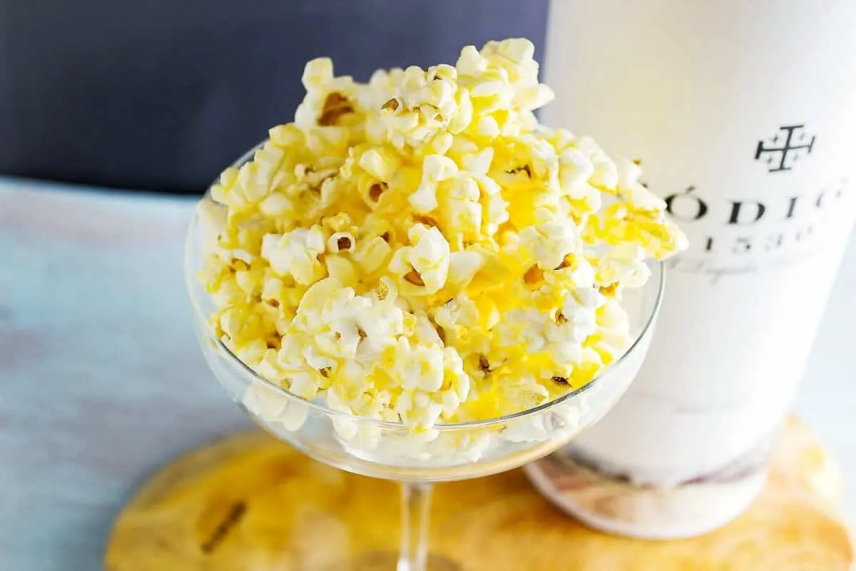 Margarita Glazed Boozy Popcorn in a margarita glass