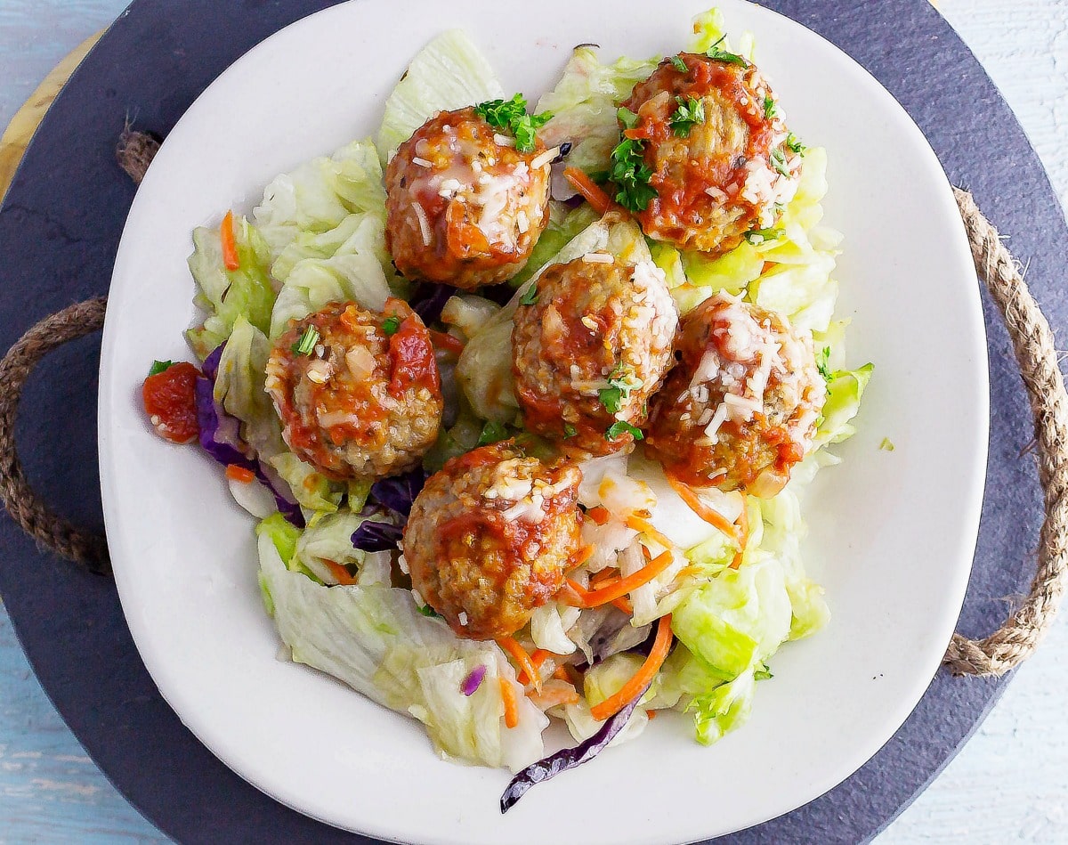 Meatball Salad is an Italian meal salad. Homemade meatballs on top of a white balsamic salad will fill you up with its yummy flavor combination.