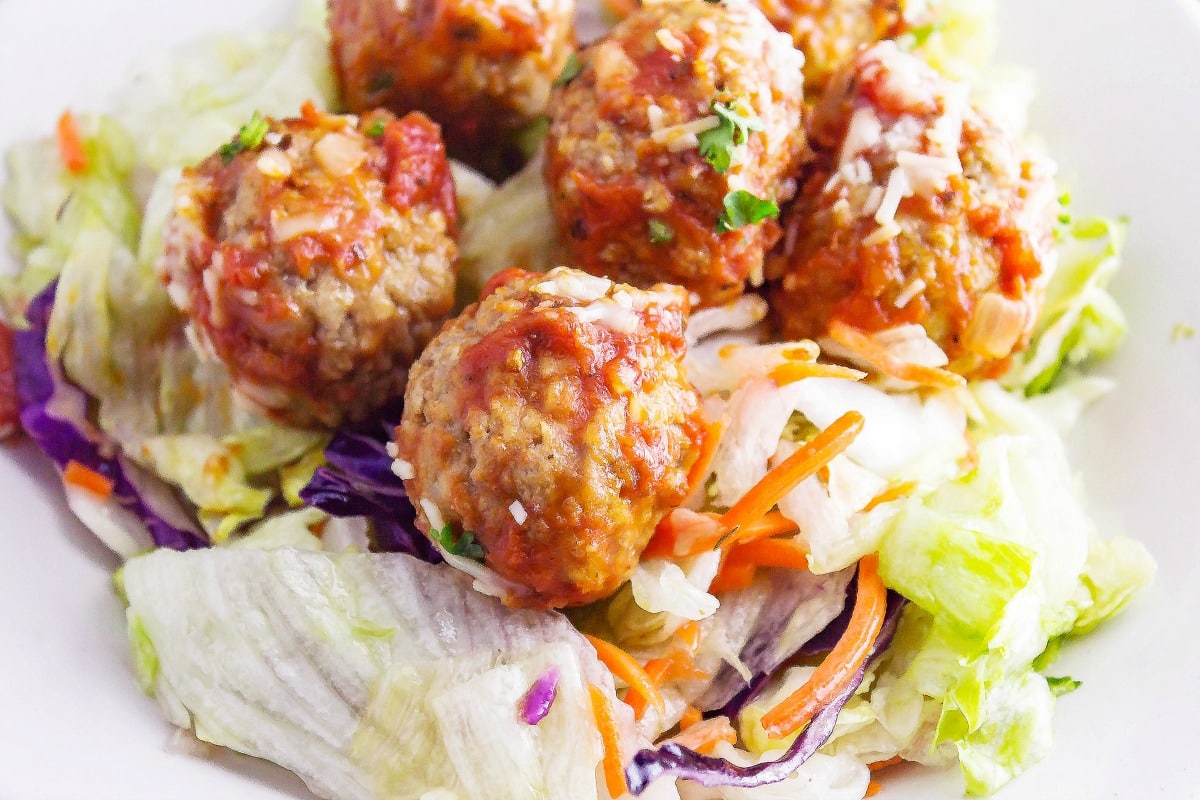 Meatball Salad is an Italian meal salad. Homemade meatballs on top of a white balsamic salad will fill you up with its yummy flavor combination.