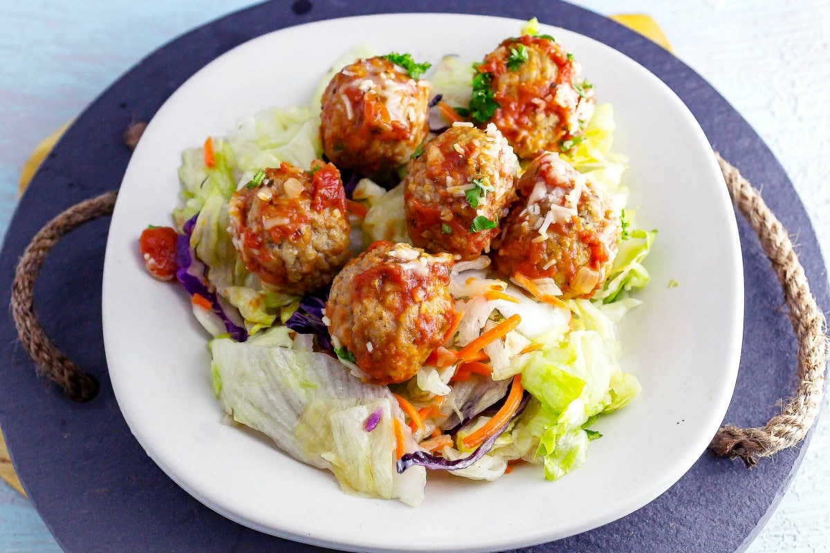 Meatball Salad is an Italian meal salad. Homemade meatballs on top of a white balsamic salad will fill you up with its yummy flavor combination.