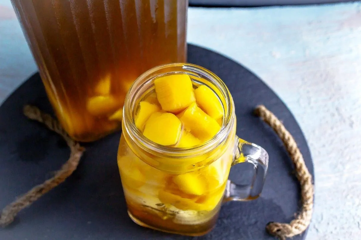 Peach Ice Tea overhead shot of chopped peaches in mason jar glass