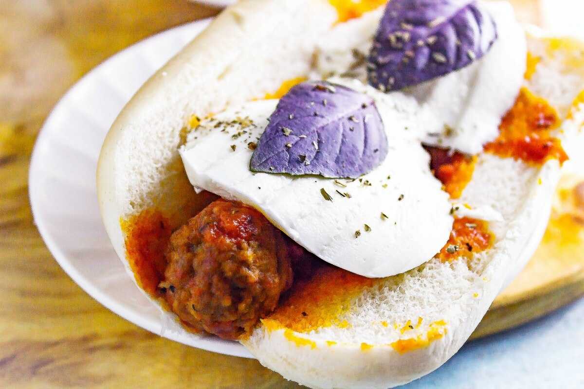 Slow Cooker Caprese Meatball Subs are actually a slow cooker budget recipe that tastes like a million dollars. It is a simple recipe using frozen meatballs, but it dressed up with fresh basil and mozzarella for a homemade taste.