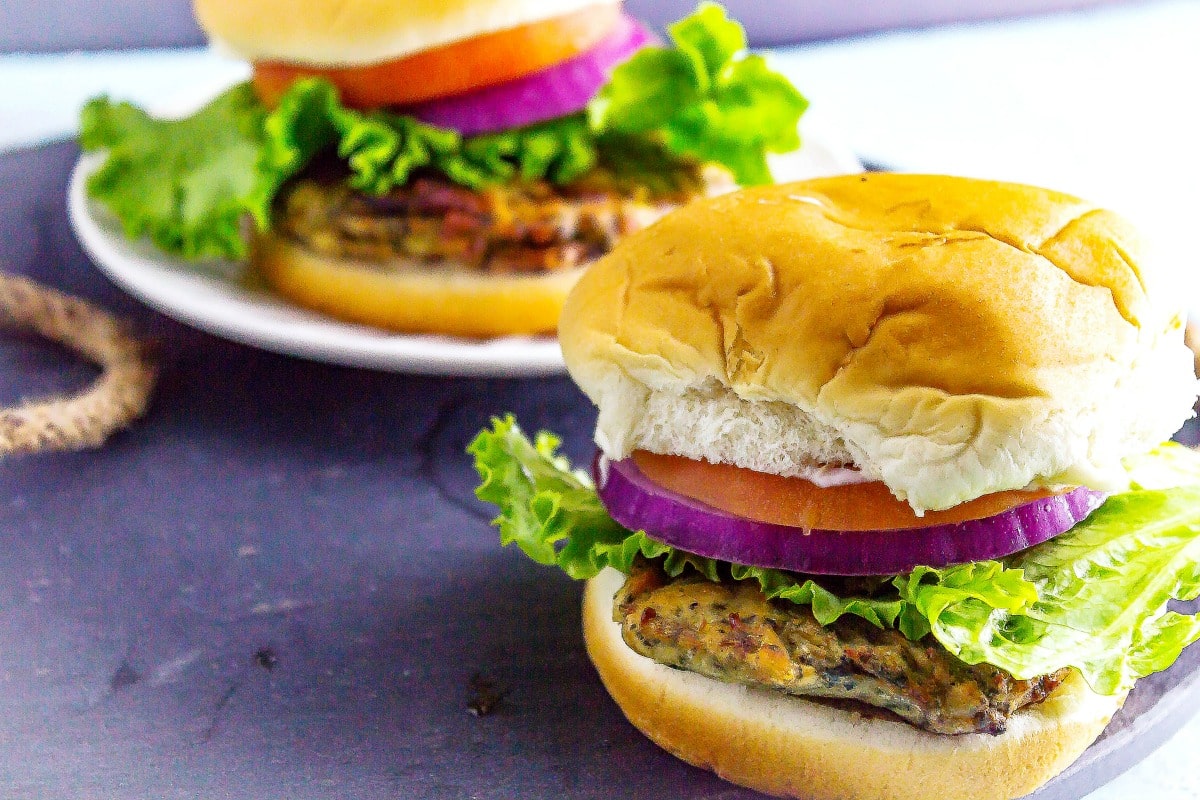 2 Greek Spinach and Feta Chicken Burgers on a serving tray