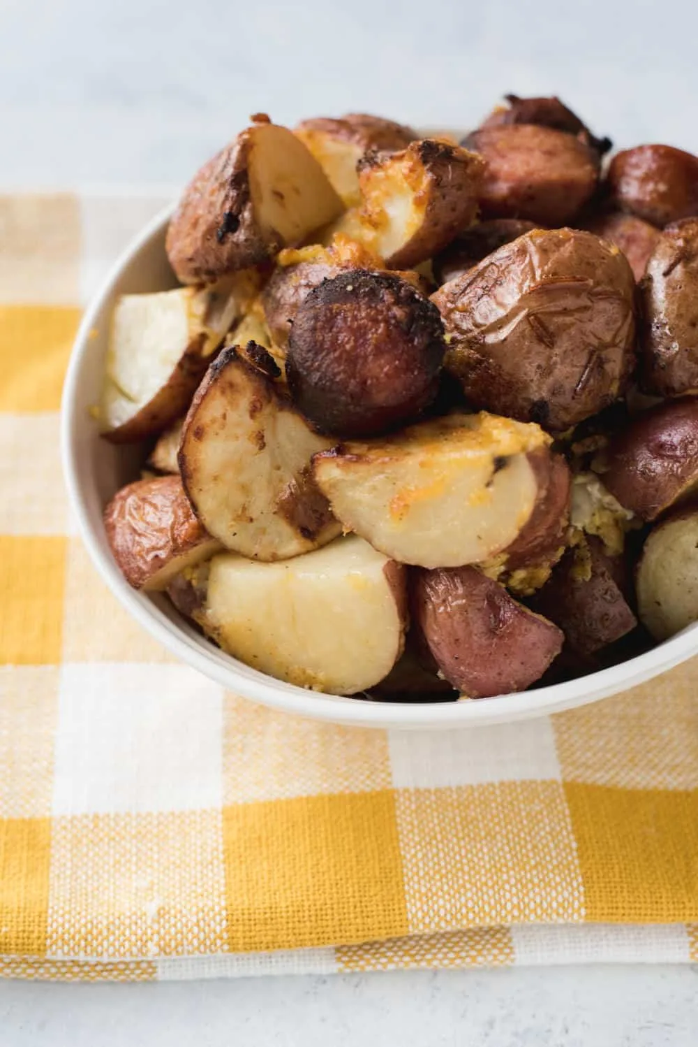 Bake Potato Casserole is a breakfast potato casserole that will knock your socks off. Cheese, onions, potatoes, and kielbasa come together for a hearty way to start your morning.