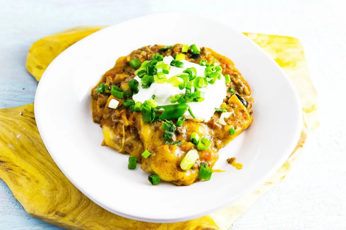 Slow Cooker Dorito Taco Casserole is an easy, fuss free way to enjoy a tasty casserole with taco taste. The best part is it is simply a dump it in and forget about it slow cooker recipe!