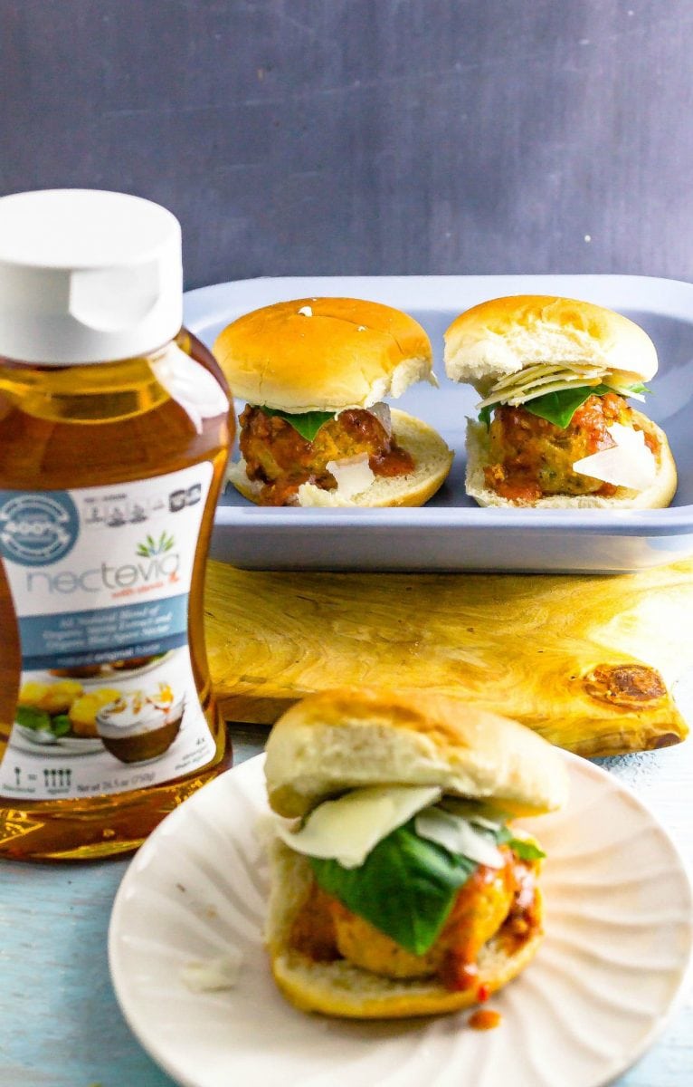 Low Sugar Chicken Meatball Parmesan Sliders is perfect for Football tailgating season. They are snack size and best of all the sauce is made with Nectevia to make it low sugar!