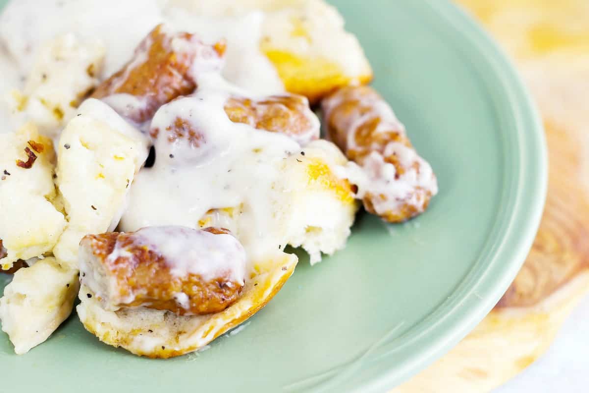 Grandma's Biscuits and Gravy Casserole is flaky, buttery biscuits drenched in a creamy sauce with sausage all baked up in a casserole.