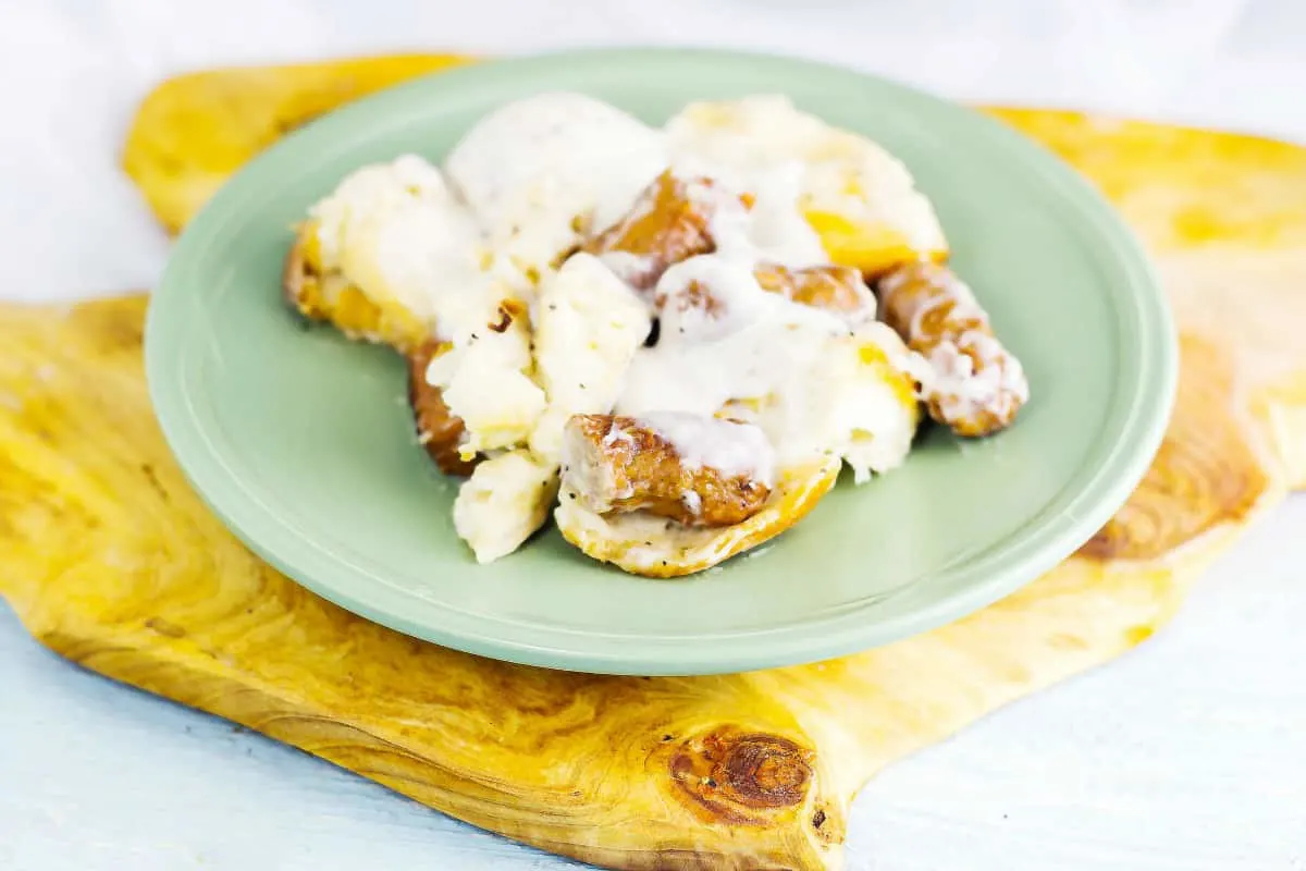 Grandma's Biscuits and Gravy Casserole is flaky, buttery biscuits drenched in a creamy sauce with sausage all baked up in a casserole.