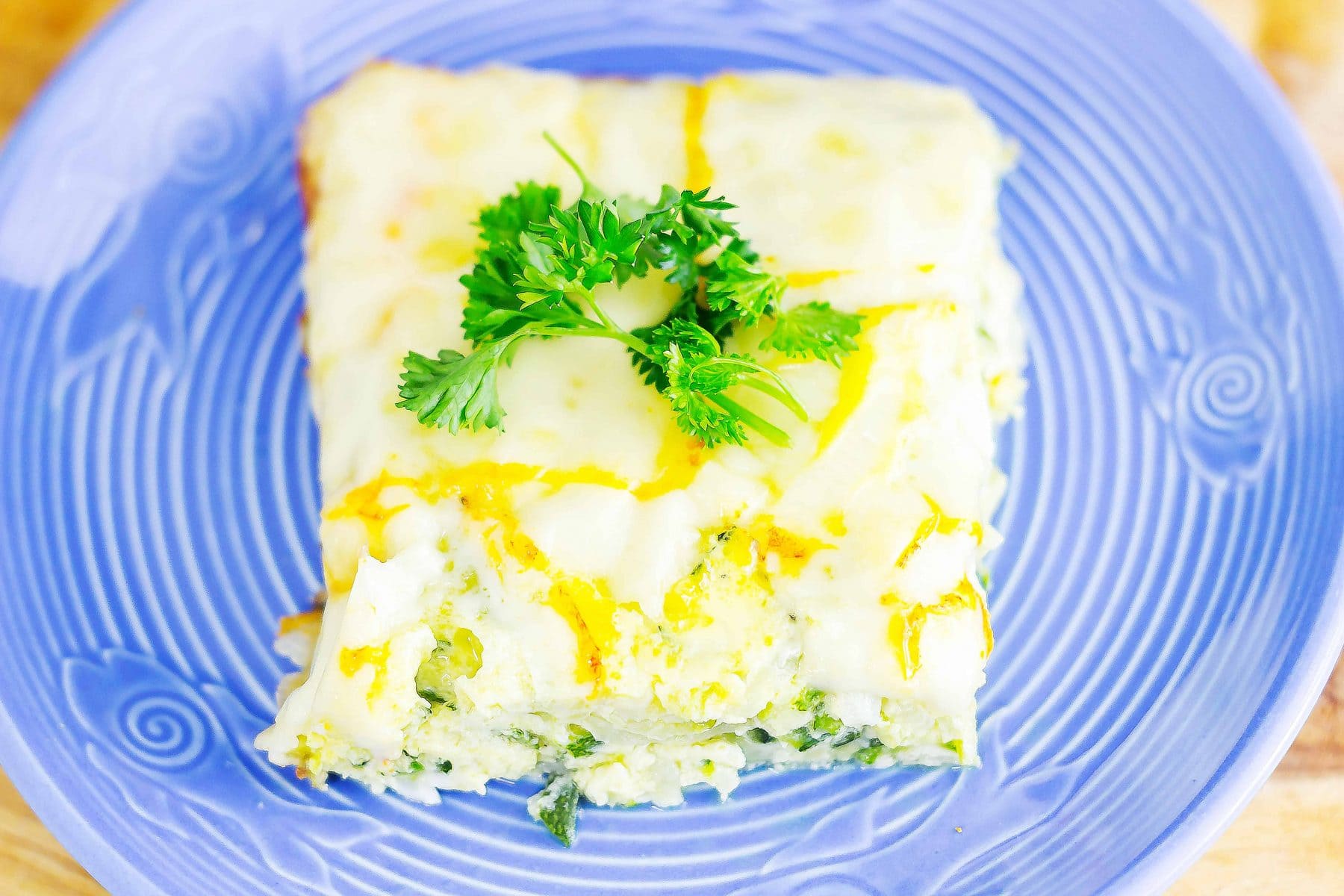 Syrian Zucchini Bake or Calavasa al Horno is a savory frittata that can be very addicting. Layers of onion, zucchini, and cheese combined with eggs in this dish.