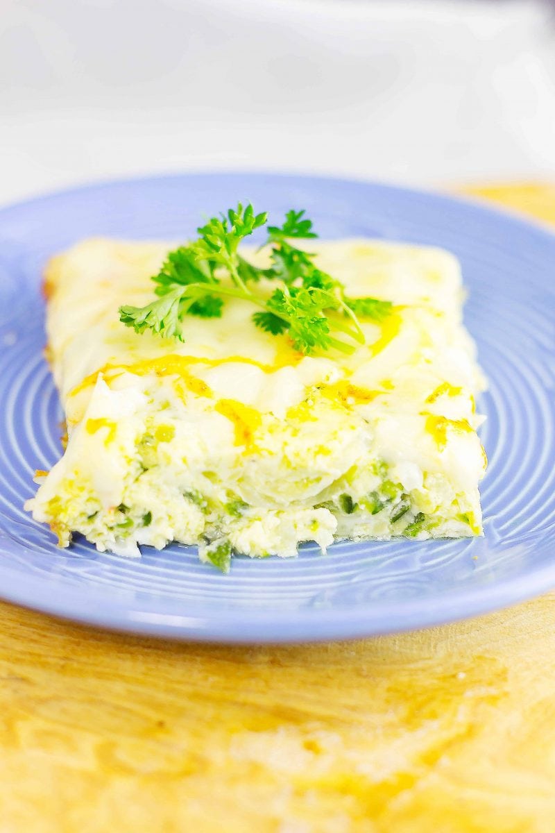 Syrian Zucchini Bake or Calavasa al Horno is a savory frittata that can be very addicting. Layers of onion, zucchini, and cheese combined with eggs in this dish.