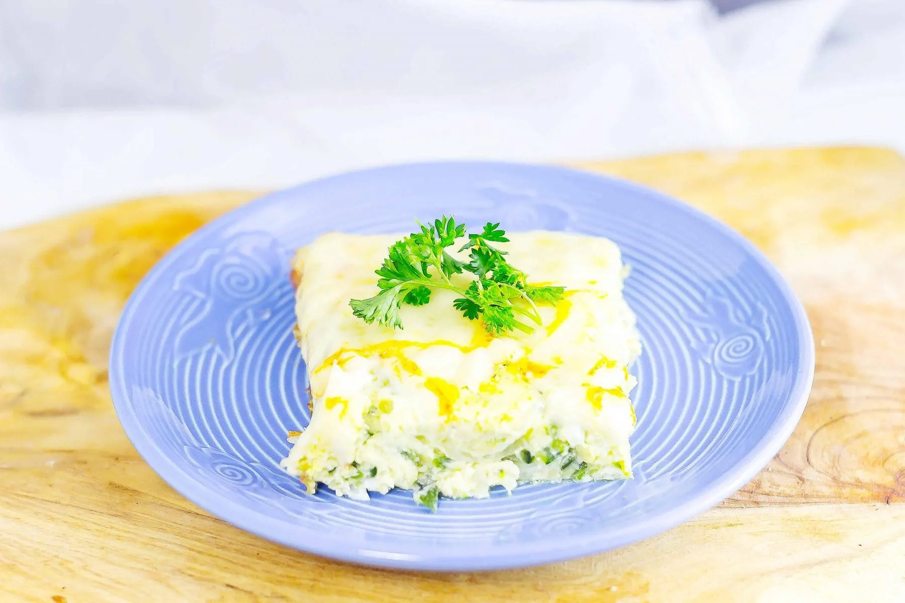 Syrian Zucchini Bake or Calavasa al Horno is a savory frittata that can be very addicting. Layers of onion, zucchini, and cheese combined with eggs in this dish.