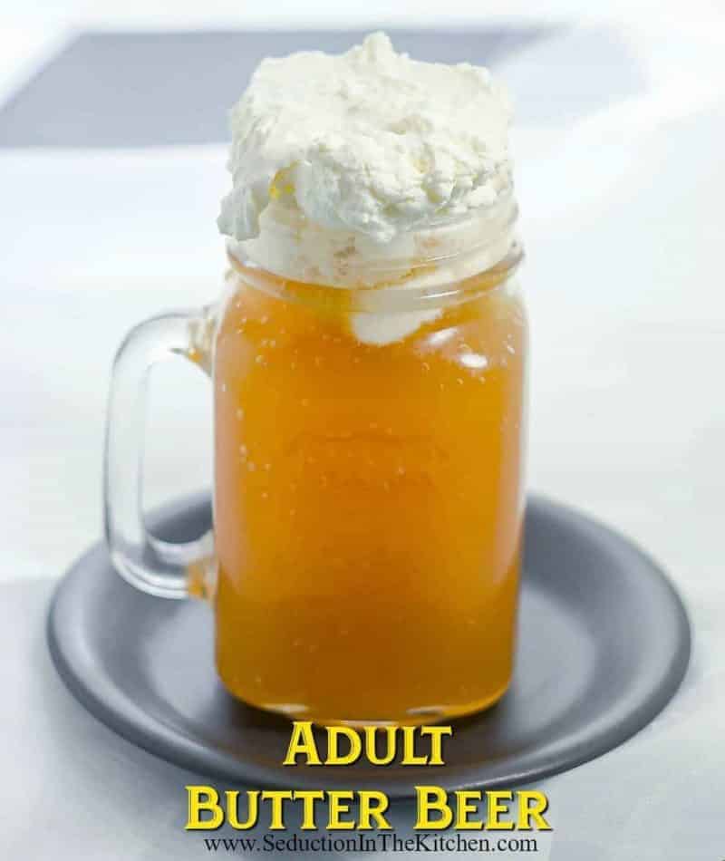 Butterbeer in a mason jar mug with whipped foam topping on black plate