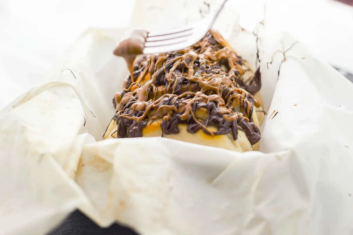 Chocolate Peanut Butter Pull Apart Bread is a peanut butter and chocolate lovers dream come true. Simple and delish is what this recipe is. the drizzle