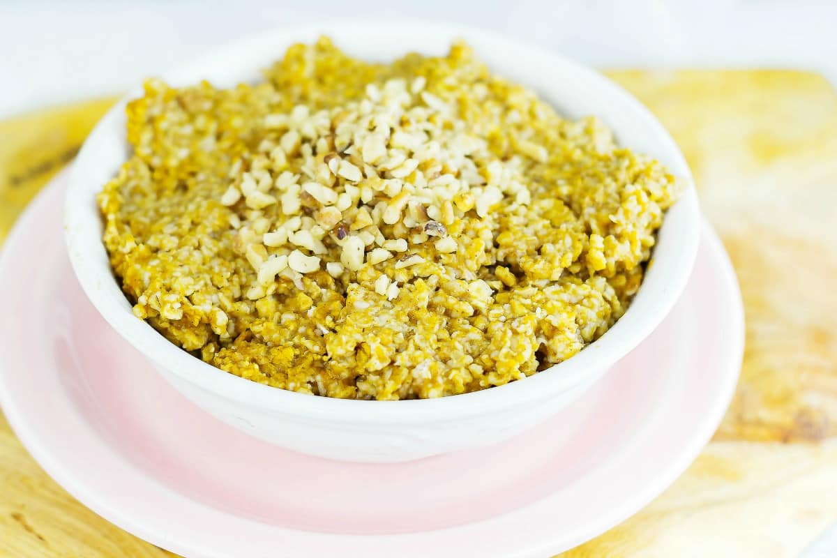 Pumpkin Pie Oatmeal in white bowl on plate