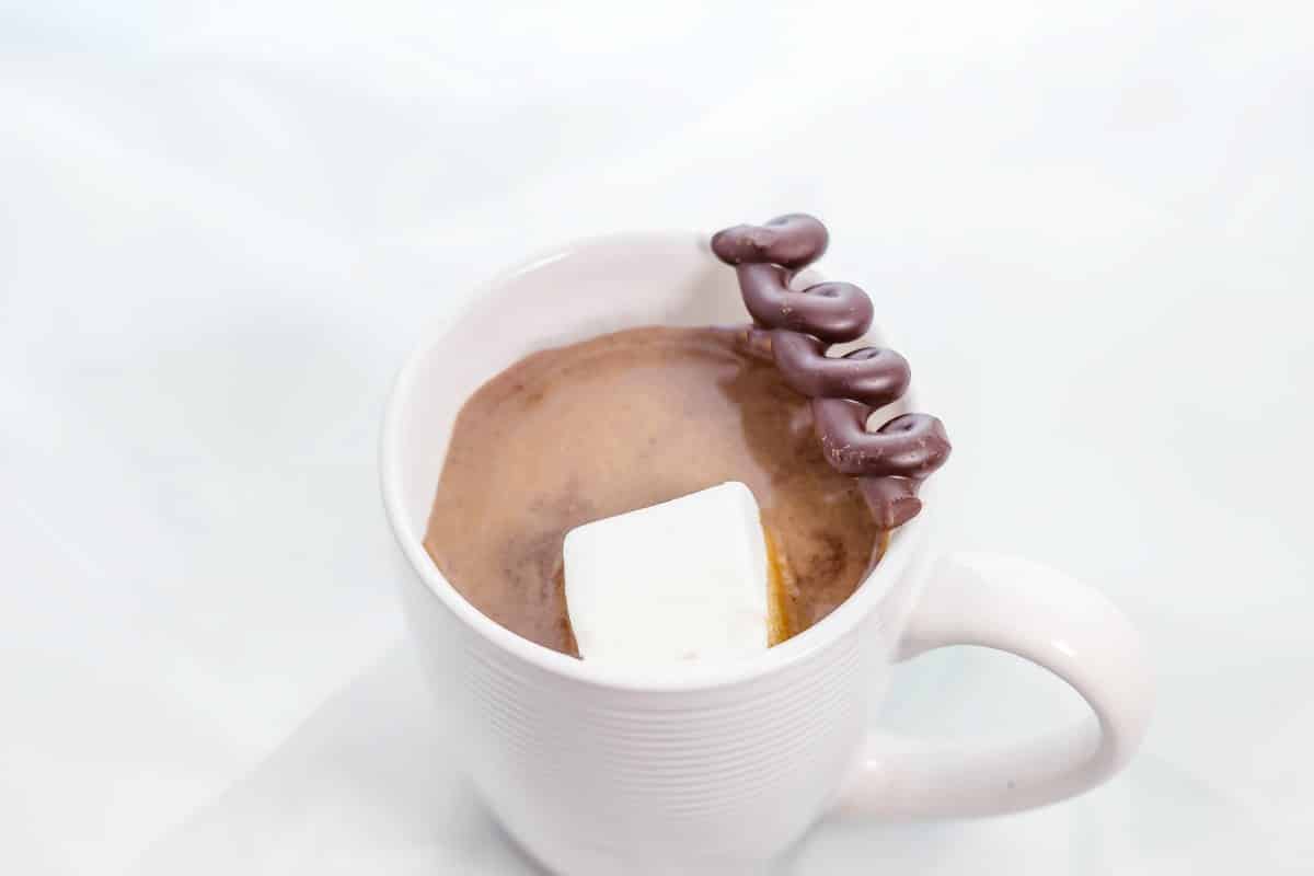 Single Serving Homemade Hot Chocolate over head with marshmallow and chocolate garnish in mug