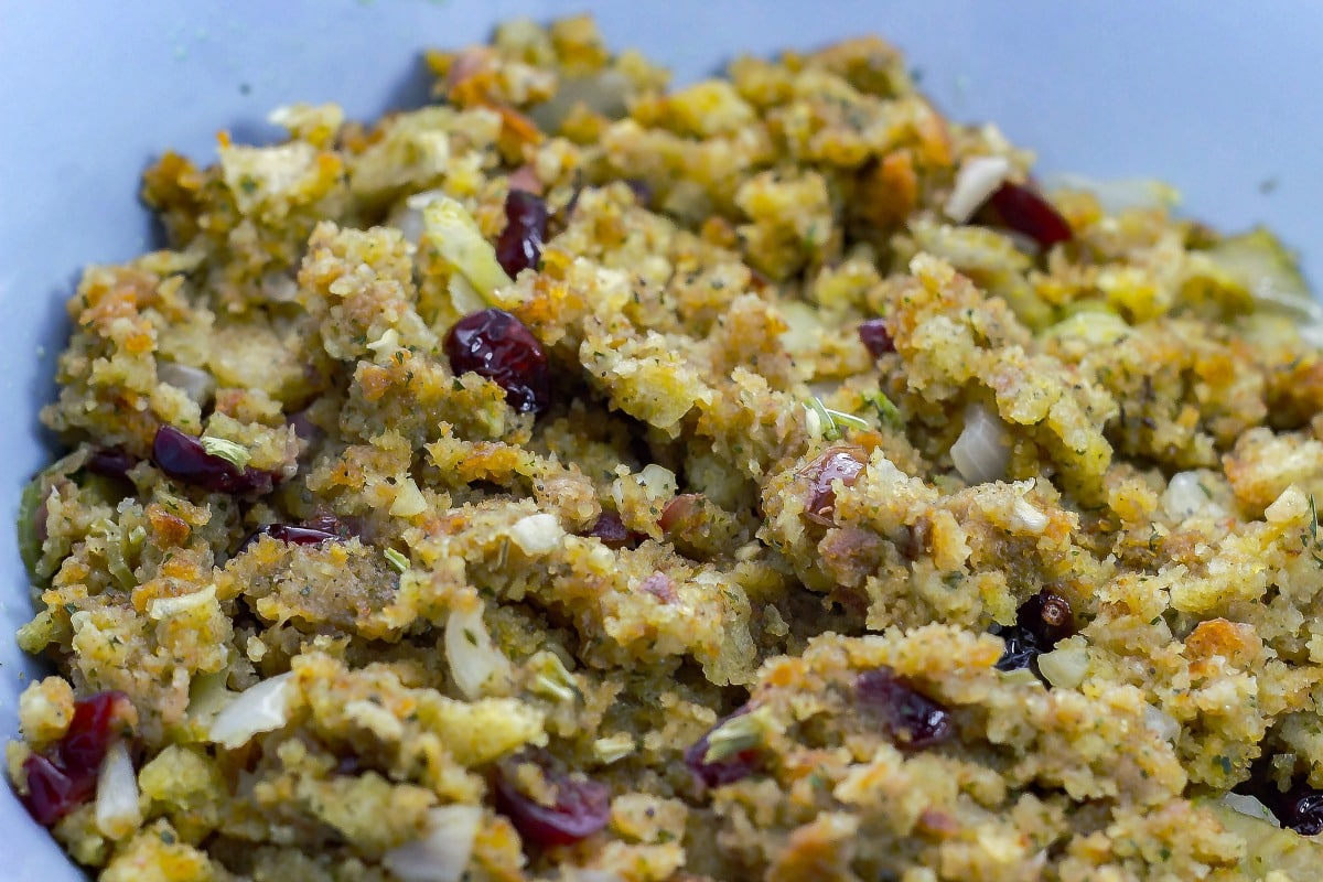 Cranberry Walnut Stuffing is a flavorful stuffing that you can make for the holidays. This savory side dish will sure to please everyone. close up