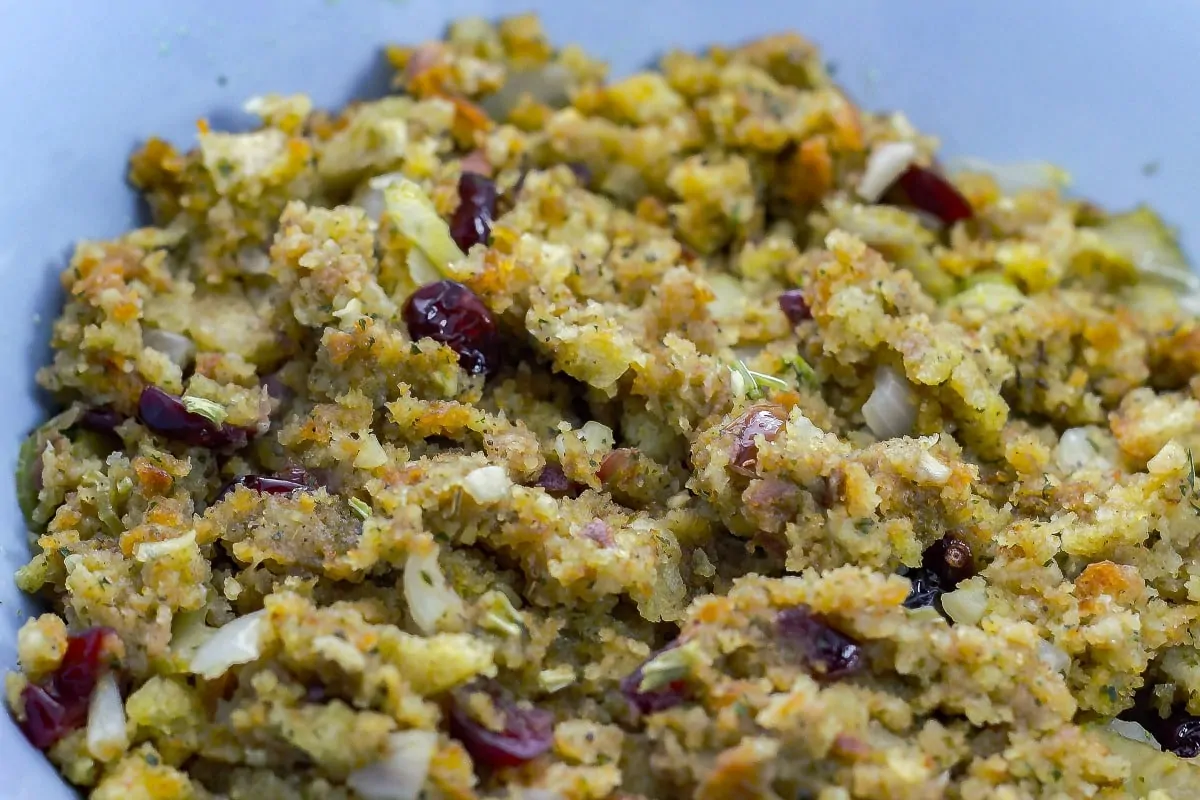 Cranberry Walnut Stuffing is a flavorful stuffing that you can make for the holidays. This savory side dish will sure to please everyone. close up