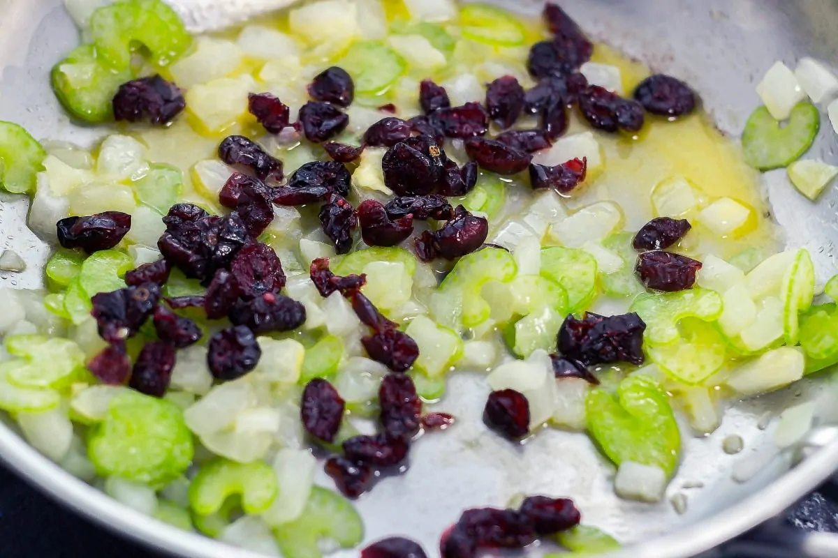 Cranberry Walnut Stuffing is a flavorful stuffing that you can make for the holidays. This savory side dish will sure to please everyone. saute onions