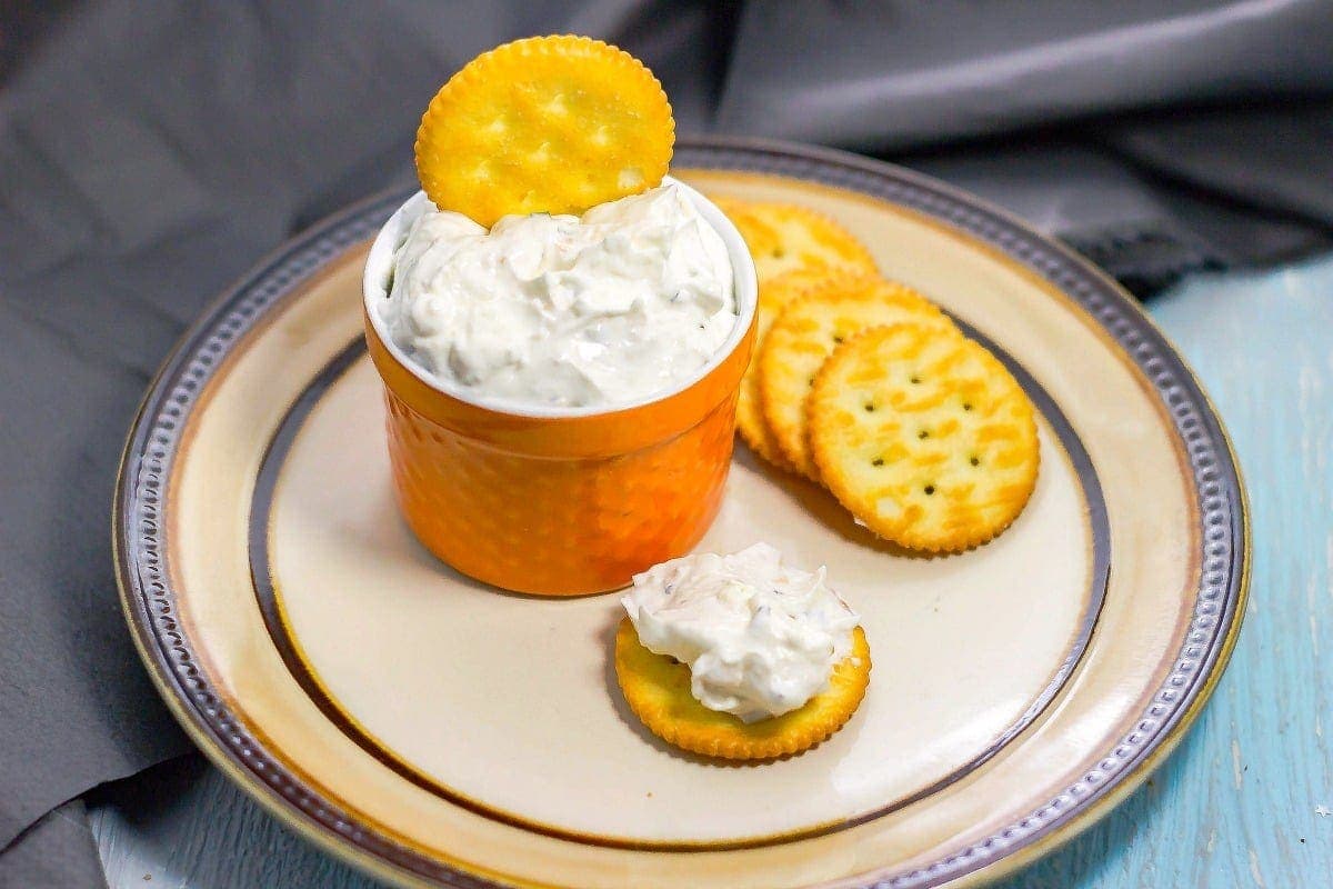 Feta Garlic and Chives Dip overhead of bowl with crackers