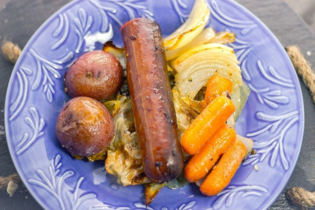 Sheet Pan Kielbasa and Cabbage uses OXO's sheet pan and silicone baking rack to create an easy buttery dinner that a family would enjoy! overhead view
