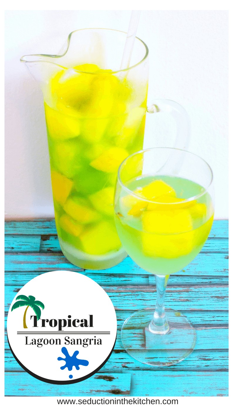 Tropical Lagoon Sangria is a fun, refreshing adult drink that is perfect to drink by the poolside in the summertime.