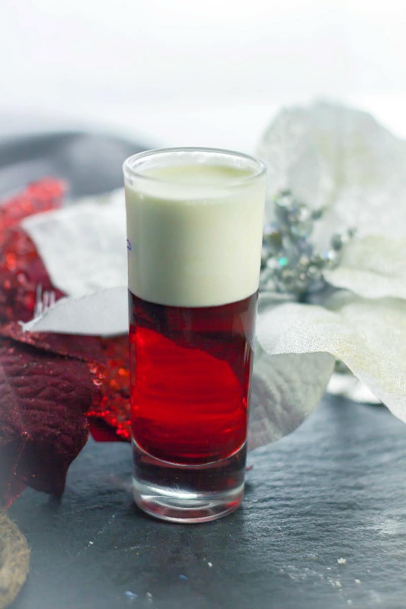 Santa Panties drink on table with red and white poinsettia