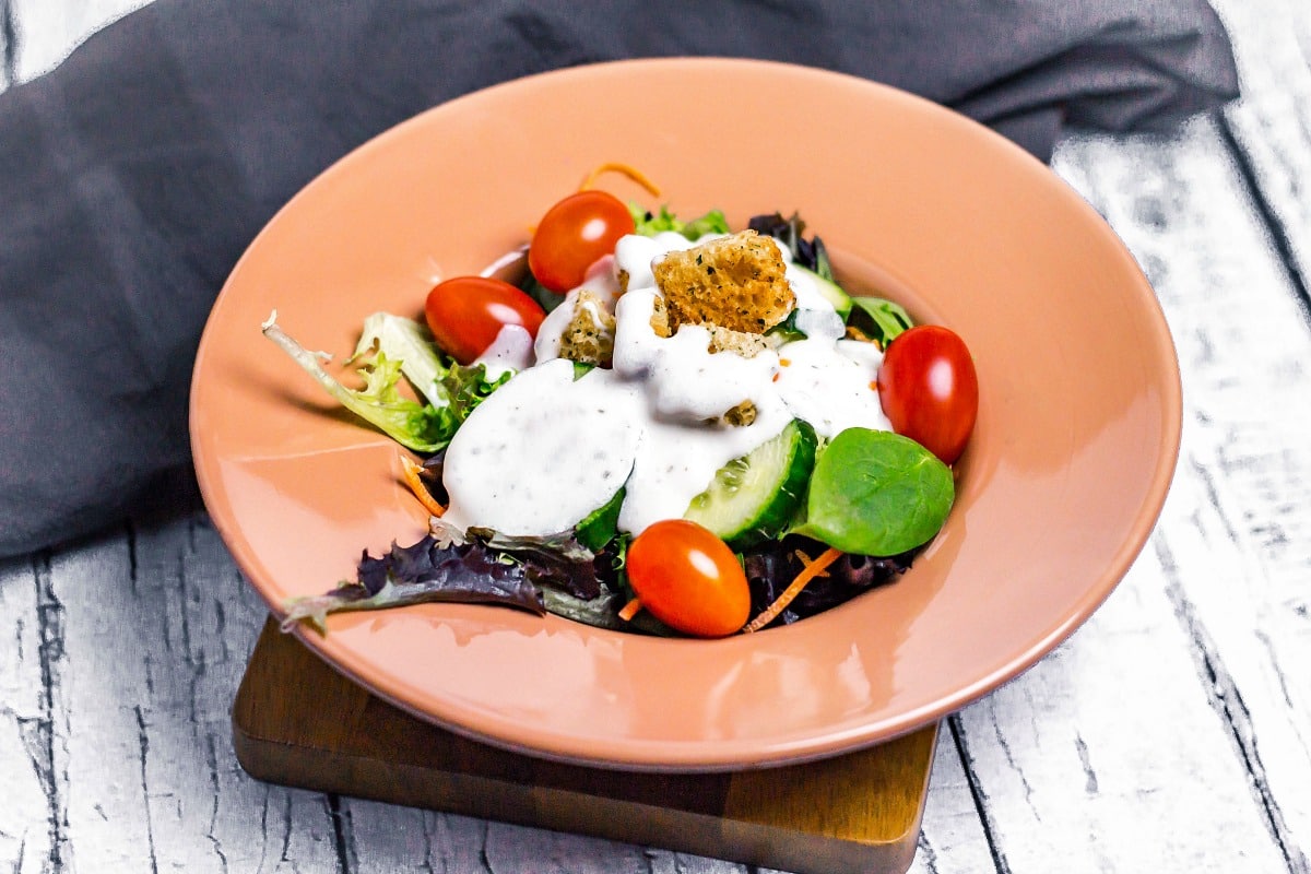 Easy Homemade Yogurt Ranch Dressing overhead view on salad in bowl