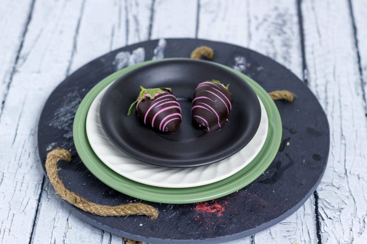 Fancy Chocolate Covered Strawberries 2 strawberries on a plate