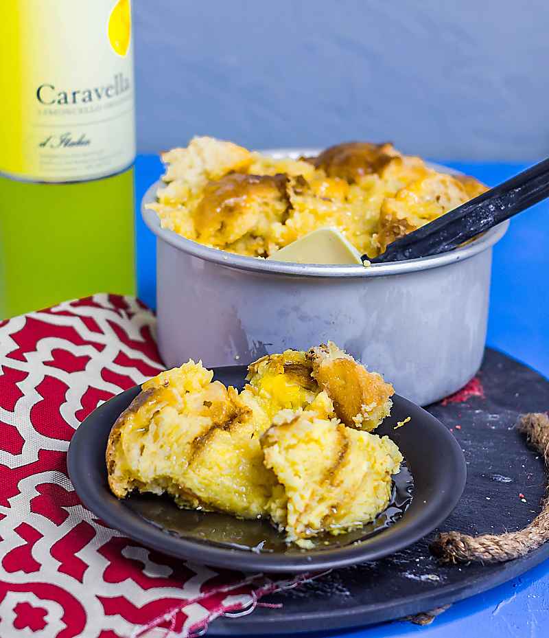 Instant Pot Limoncello Bread Pudding on table with bottle limocello