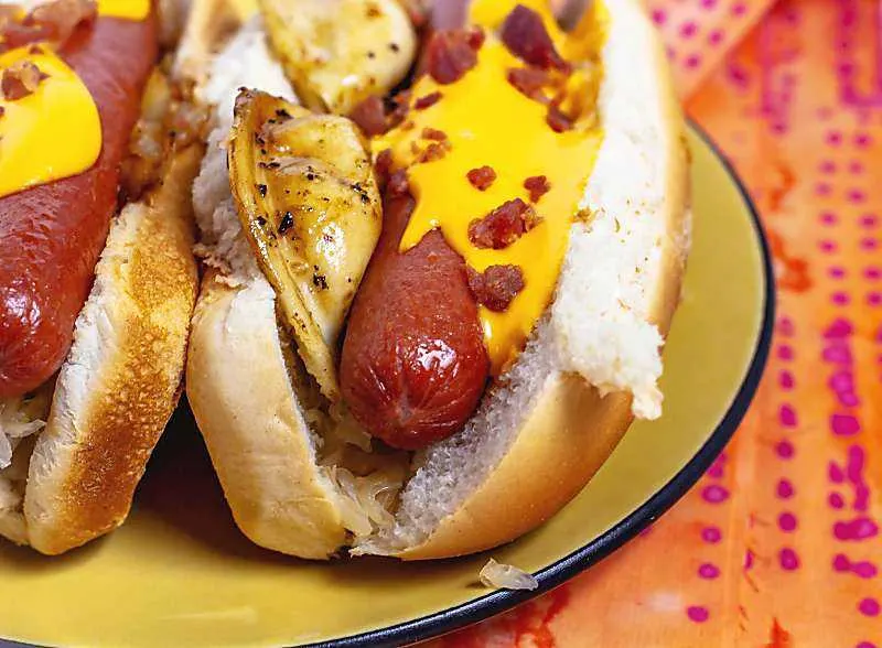 Take me out to the ball game! This stadium dog is inspired by my hometown, Pittsburgh. side view of piergi hot dog on hellow plate