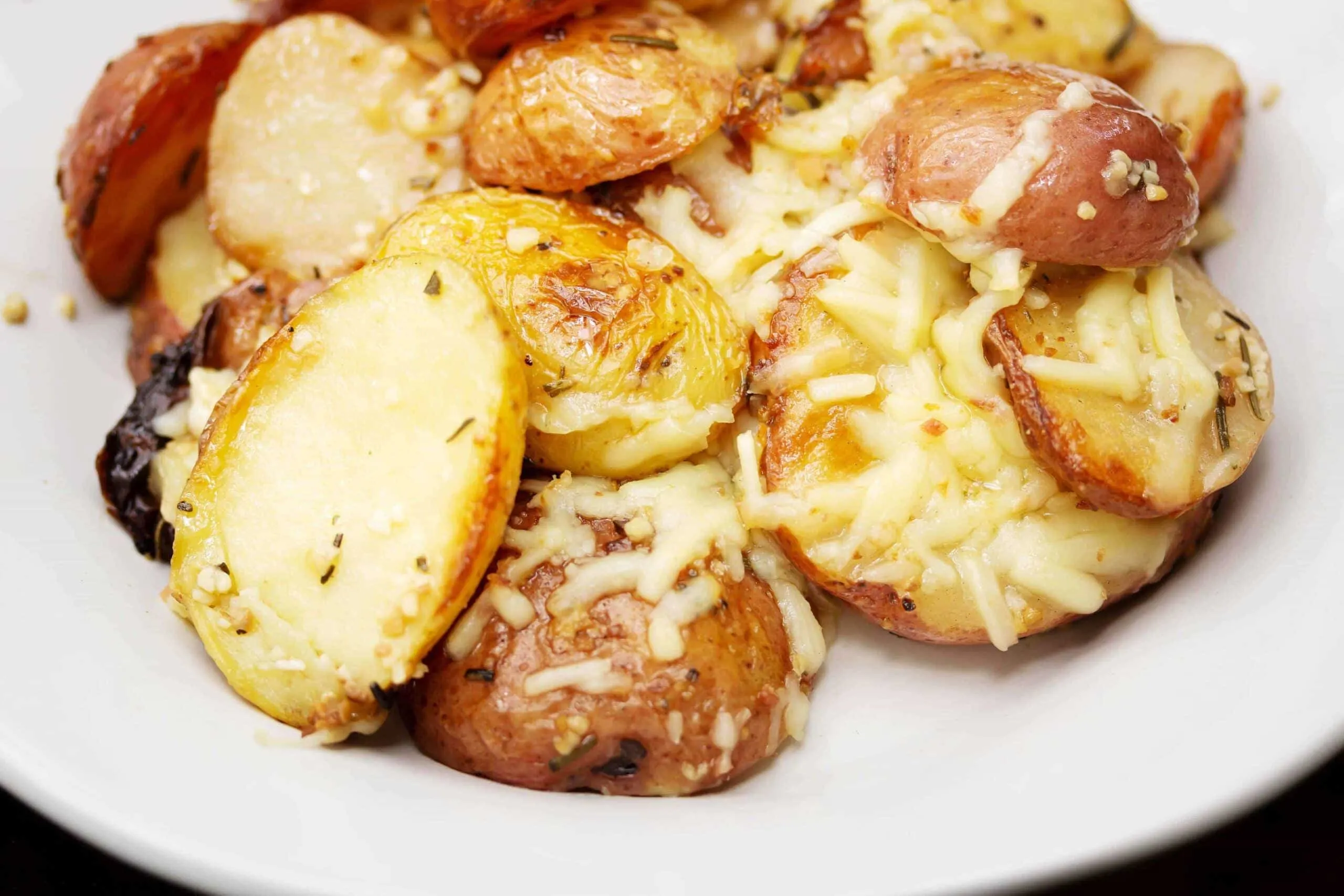 Cheesy Roasted Garlic Rosemary Potatoes