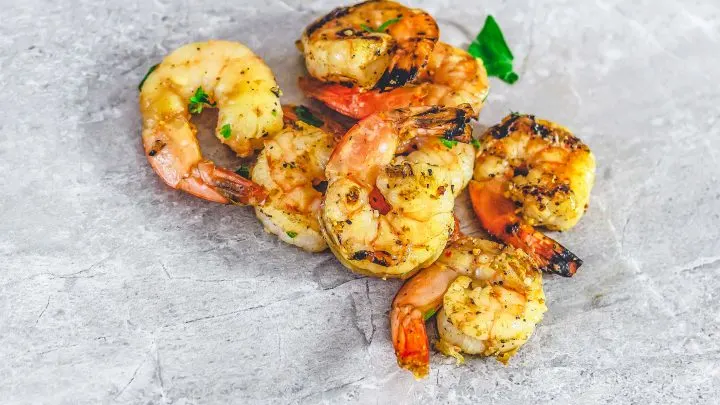 French Onion Grilled Shrimp on grey marble surface